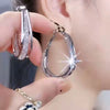 GRACE | Twisted Crystal Oval Hoop Earrings