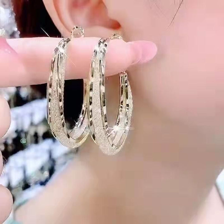 GRACE | Twisted Crystal Oval Hoop Earrings